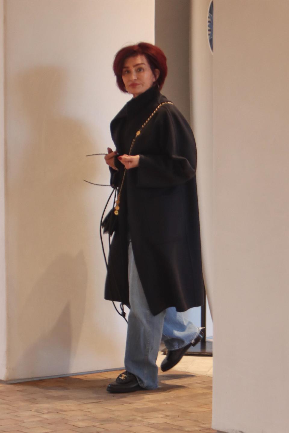 Beverly Hills, CA - Sharon Osbourne seems to be doing ok after being Hospitalized While Filming Ghost-Themed TV a few days ago. Sharon was spotted doing some retail therapy at James Perse in Beverly Hills. 