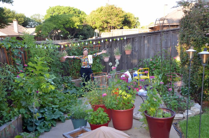 Stephanie Hollowell poses in her backyard garden in Dallas