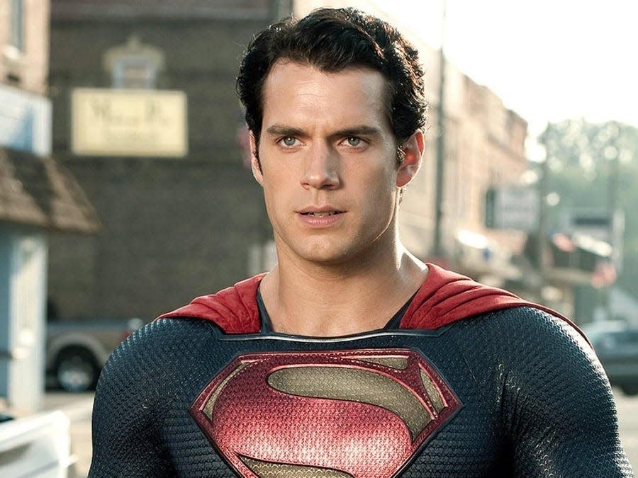 Henry Cavill as Superman standing in Smallville.