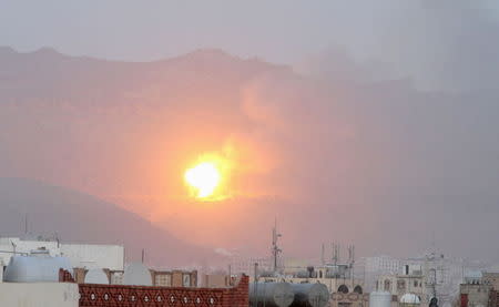 Fire is seen from the Noqum Mountain after it was hit by an air strike in Yemen's capital Sanaa May 19, 2015. REUTERS/Mohamed al-Sayaghi