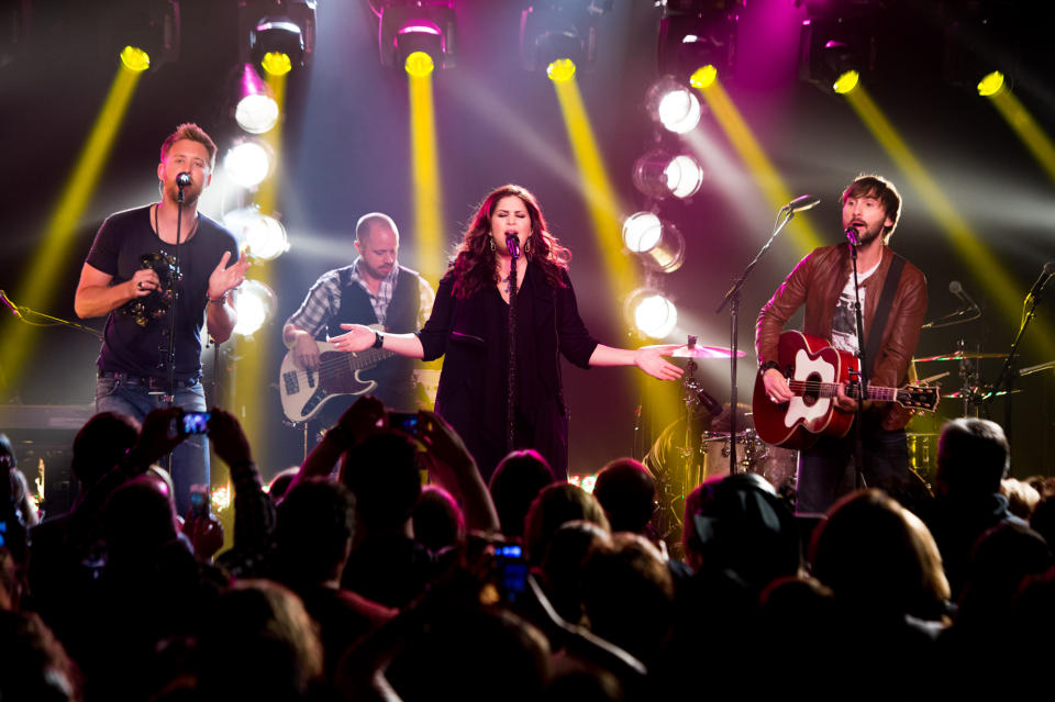 This May 8, 2013 photo released by iHeartRadio shows members of the band Lady Antebellum, from left, Charles Kelley, Hillary Scott, and Dave Haywood during a performance in New York. The intimate show was part of iHeartRadio Live, a Clear Channel entertainment production that features performances by today's top recording artists. (AP Photo/iHeartRadio, Chris Owyoung)