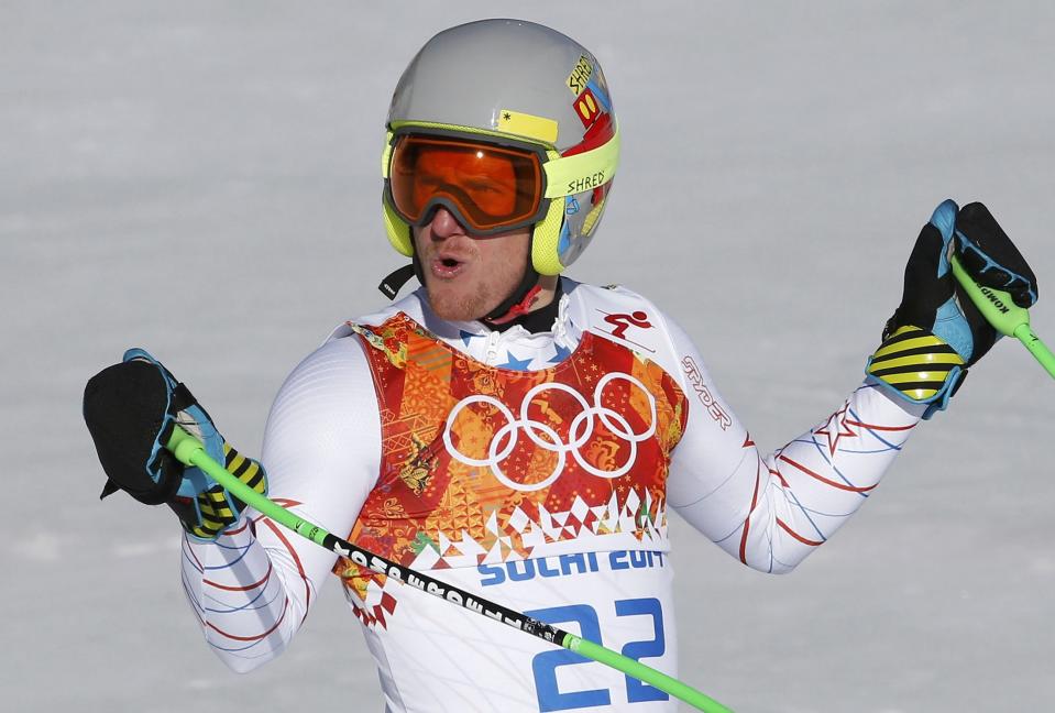 Ted Ligety of the U.S. reacts in the finish area after competing in the downhill run of the men's alpine skiing super combined event during the 2014 Sochi Winter Olympics at the Rosa Khutor Alpine Center in Rosa Khutor February 14, 2014. REUTERS/Leonhard Foeger