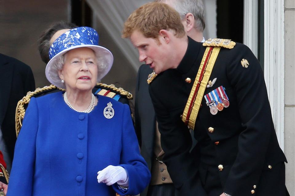 Prince Harry chats with the Queen on the balcony of Buckingham Palace in 2013 at the annual Trooping the Colour. 