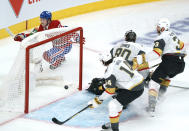 Montreal Canadiens' Cole Caufield (22) celebrates his goal past Vegas Golden Knights goaltender Robin Lehner as teammates Nicolas Hague (14) and Brayden McNabb (3) look on during the second period in Game 6 of an NHL hockey Stanley Cup semifinal playoff series Thursday, June 24, 2021 in Montreal. (Paul Chiasson/The Canadian Press via AP)