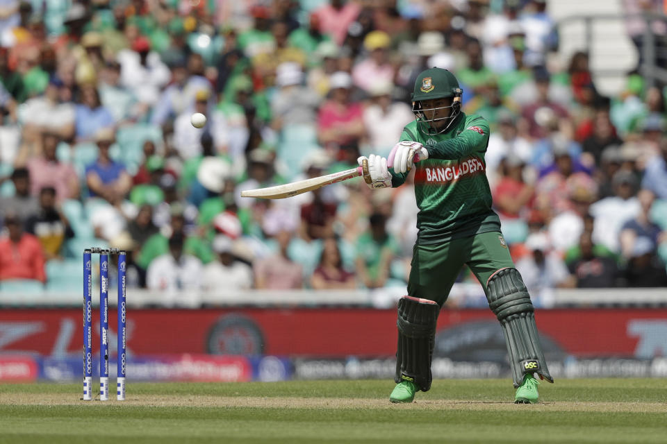 Bangladesh's Mushfiqur Rahim hits a shot that was caught out by South Africa's Rassie van der Dussen during the Cricket World Cup match between South Africa and Bangladesh at the Oval in London, Sunday, June 2, 2019. (AP Photo/Matt Dunham)