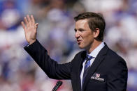 Former New York Giants quarterback Eli Manning addresses the crowd during a ceremony to retire his jersey number 10 and honor his tenure with the team during half-time in an NFL football game against the Atlanta Falcons, Sunday, Sept. 26, 2021, in East Rutherford, N.J. (AP Photo/Seth Wenig)