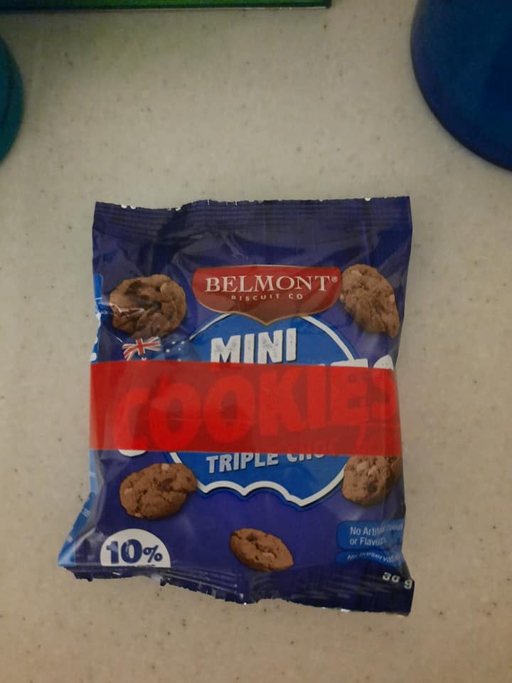 An Aldi shopper has been left stumped after spotting red tape on a cookie packet. Photo: Facebook (supplied).