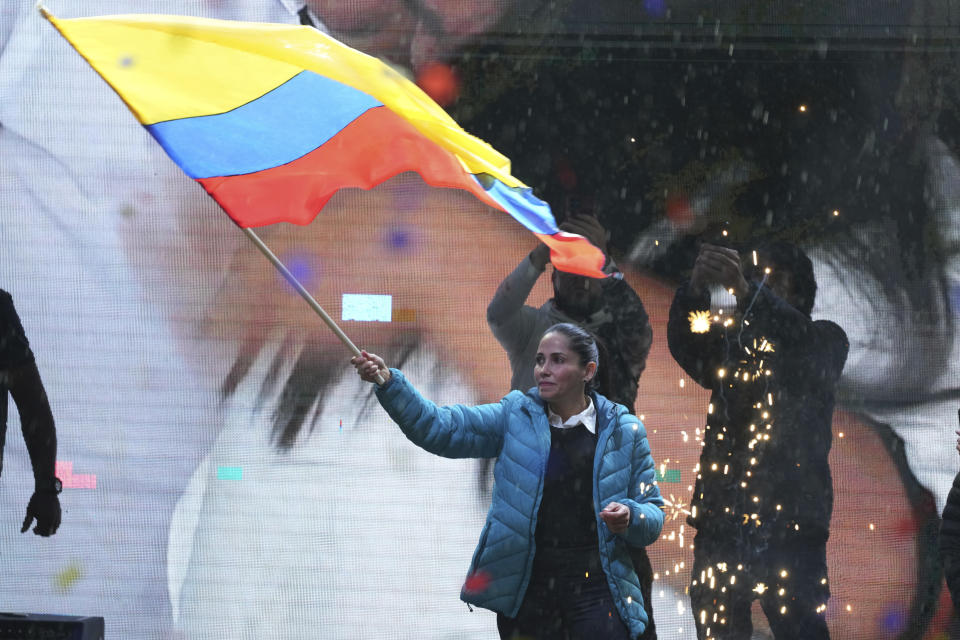 Presidential candidate Luisa Gonzalez, of the Citizen's Revolutionary Movement, waves an Ecuador national flag during a campaign event in Quito, Ecuador, Wednesday, Oct. 11, 2023. (AP Photo/Dolores Ochoa)
