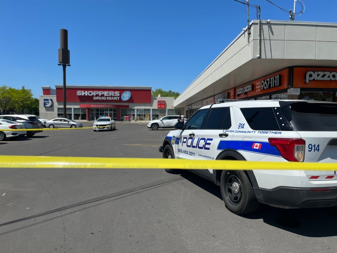 A police spokesperson told media at the scene where a teen girl was found injured in Brampton Friday that police didn't know if the weapon involved was a real gun or an 'imitation firearm.' They later confirmed it was a replica. (Patrick Swadden/CBC - image credit)