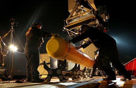 The Phoenix International Autonomous Underwater Vehicle (AUV) Artemis, also known as the Bluefin-21, is prepared for deployment from the Australian Defence Vessel Ocean Shield in the search for missing Malaysia Airlines Flight MH370 in the Southern Indian Ocean in this undated picture released on April 21, 2014 by the Australian Defence Force. REUTERS/Australian Defence Force/Handout via Reuters (