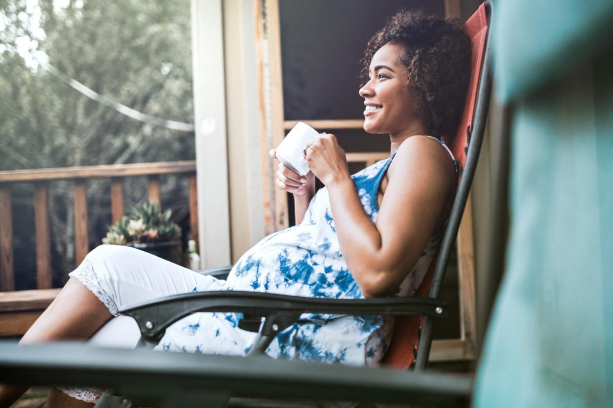 Pregnant Woman breast changes Relaxing With Tea