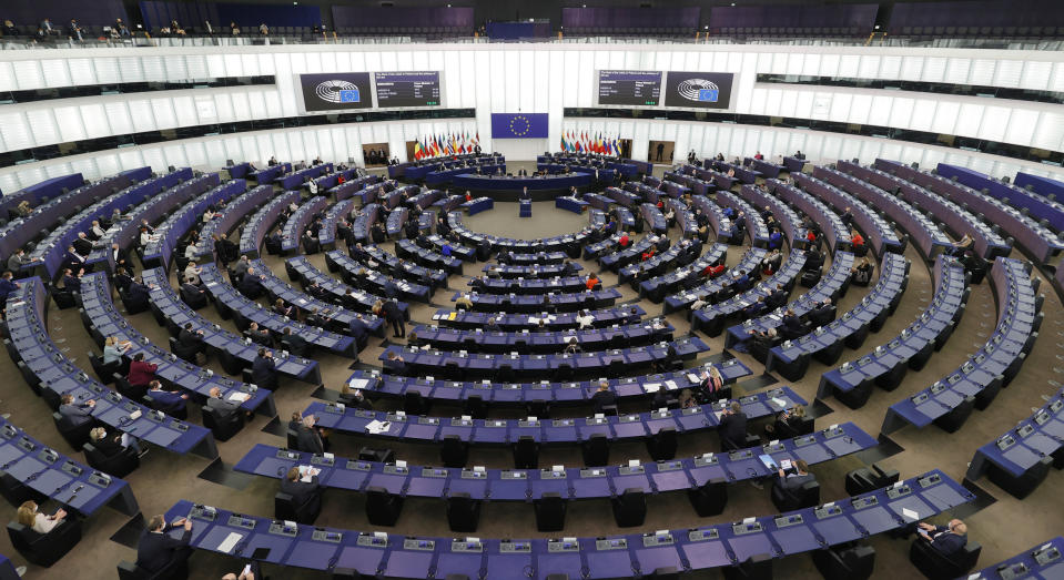 Poland's Prime Minister Mateusz Morawiecki, center, delivers his speech Tuesday, Oct. 19, 2021 at the European Parliament in Strasbourg, eastern France. The European Union's top official locked horns Tuesday with Poland's prime minister, arguing that a recent ruling from the country's constitutional court challenging the supremacy of EU laws is a threat to the bloc's foundations and won't be left unanswered. (Ronald Wittek, Pool Photo via AP)