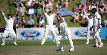 New Zealand's Trent Boult appeals unsuccessfully for the wicket of India's Cheteshwar Pujara (R) during the first innings on day one of the second international test cricket match at the Basin Reserve in Wellington, February 14, 2014.