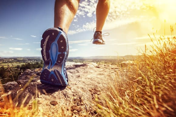 A jogger running a trail.