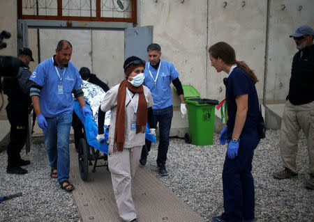 A wounded Iraqi arrives for treatment at the emergency field hospital run by the US Christian charity Samaritan's Purse, eastern Mosul, Iraq March 22, 2017. Picture taken March 22, 2017. REUTERS/Suhaib Salem