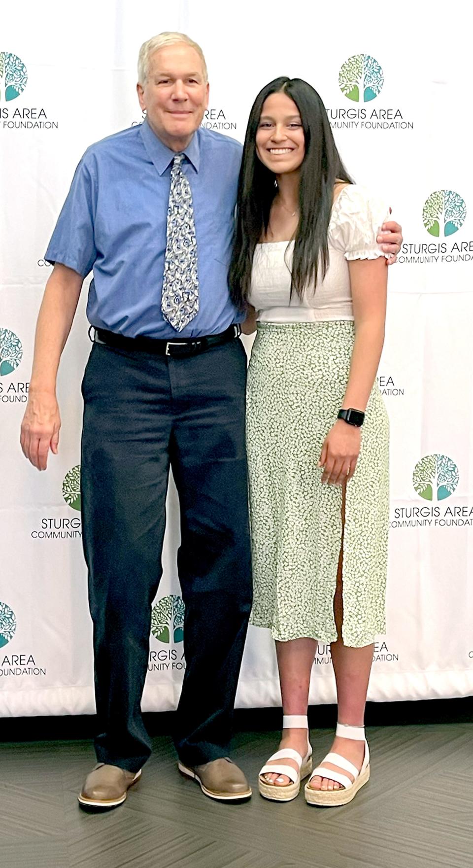 Sturgis High School senior Nancy Montoya stands with Harley Pierce Jr., after being awarded the Harley and Eva Pierce Memorial Scholarship.