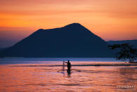 Taal Volcano as seen from Talisay, Batangas. Fishers and farmers live on and around Volcano Island despite the risk of eruptions. (Yen Baet)