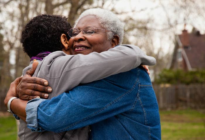 A daughter hugging her older mom