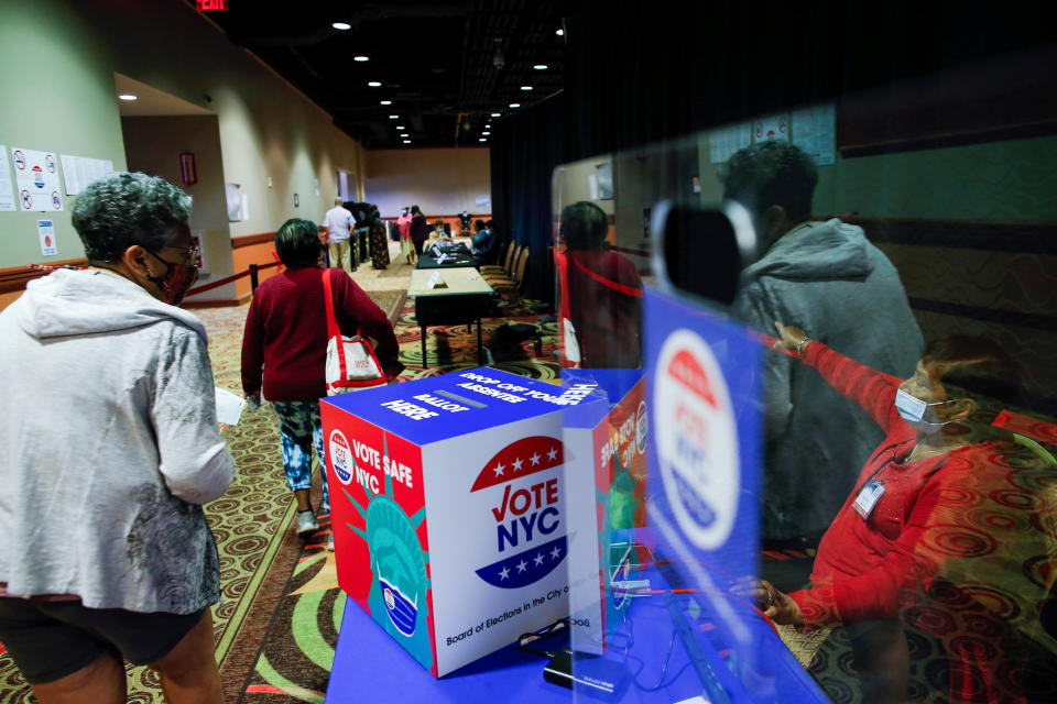 People arrive to the voting center on the first day of early voting for the New York Primary election at Resorts World Casino in Queens, New York City, U.S., June 12, 2021. (Eduardo Munoz/Reuters)