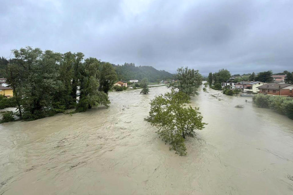 A view of an overflowing Savio river in Cesena, central Italy, Wednesday, May 17, 2023. The mayor of the city of Cesena, Enzo Lattuca, posted a video early Wednesday on Facebook to warn that continued heavy rains in the Emilia-Romagna region could again flood the Savio river and smaller tributaries. He urged residents to move to upper floors of their homes and avoid riverbanks, and announced the closure to traffic of some bridges and streets after heavy flooding sent rivers of mud sloshing through town. (LaPresse via AP)