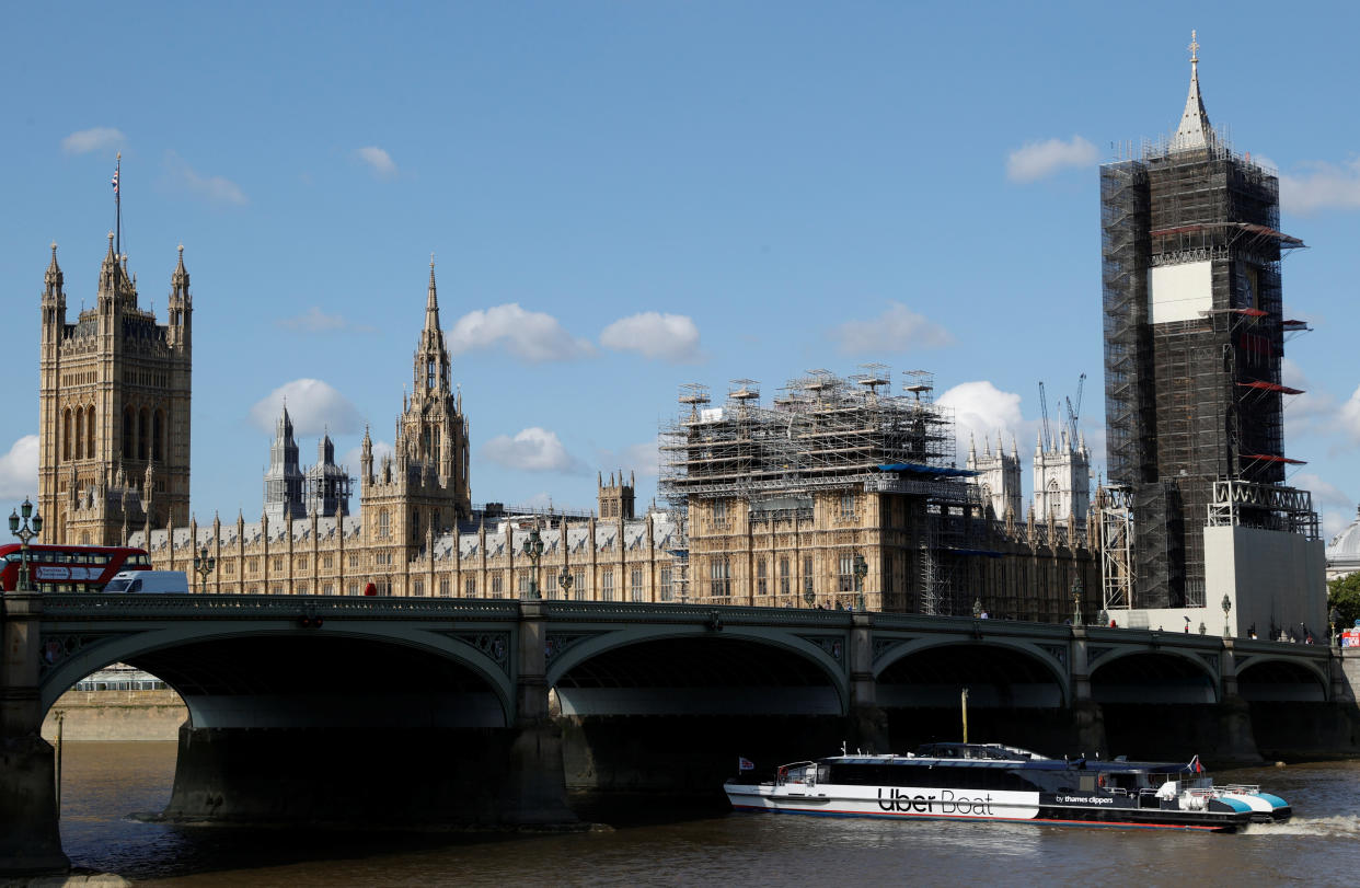 An Uber boat passes under Westminster bridge with the Houses of Parliament in the background, as it operates following the launch of the new boat service on the River Thames in London, Britain, August 3, 2020.  REUTERS/John Sibley