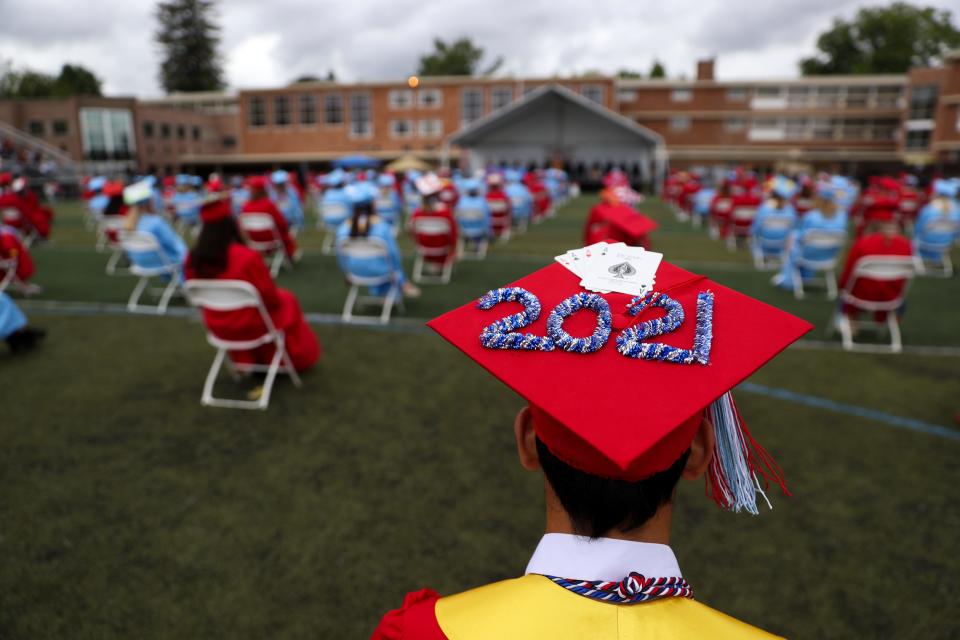 Graduates listen to speakers during South Salem High School's 67th commencement ceremony at the South Salem High School in Salem, Oregon on Friday, June 11, 2021.