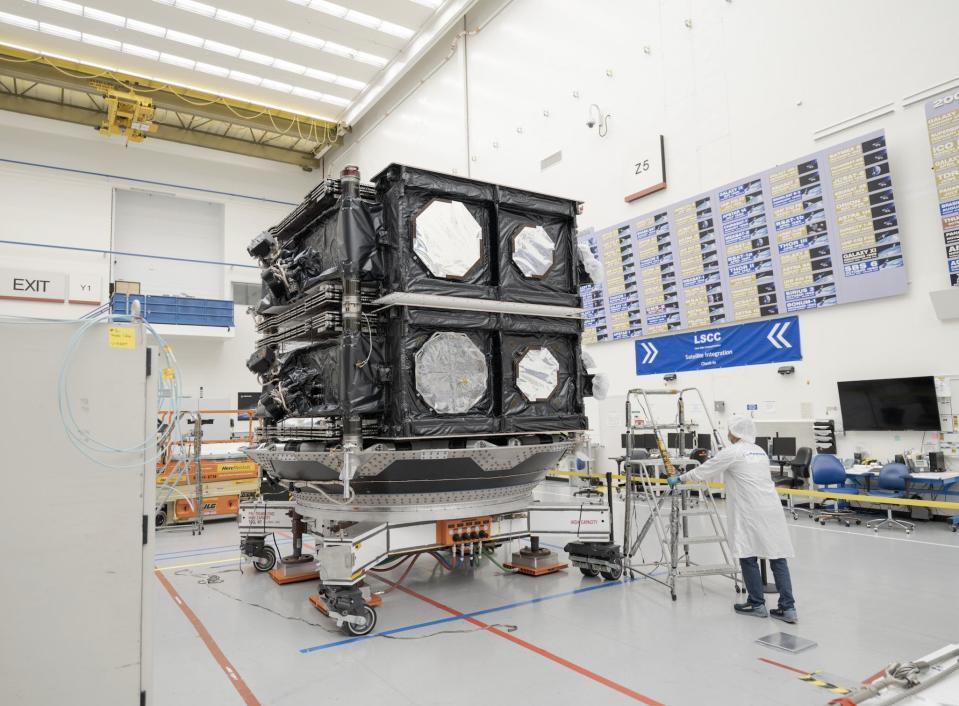 The Luxembourg-based satellite company SES released this photo of a technician making preparations alongside O3b mPOWER satellites in advance of SpaceX's Nov. 12 mission launching them into medium-Earth orbit from Cape Canaveral Space Force Station.