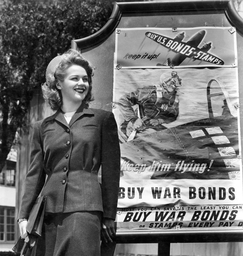 Women in front of a War Bonds sign in 1943