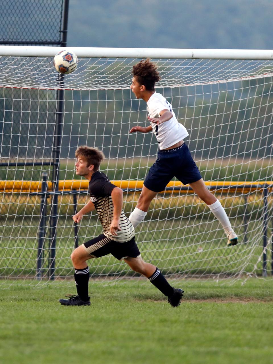 Morgan's Tavian Myers heads the ball over River View's Reid Dobson on Tuesday in Warsaw. River View's 7-0 win was its  fourth straight and fifth in six games.