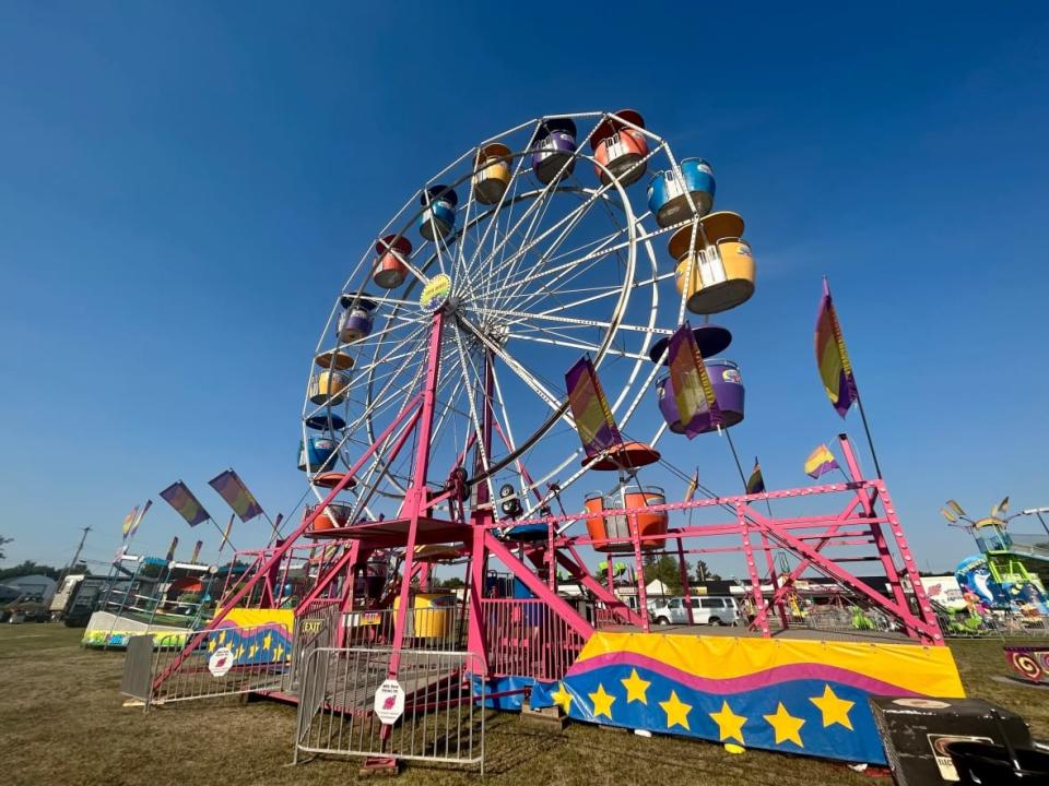 Midway ride events in Devon and Brooks, Alta., will go ahead as planned. Inspections were underway on Wild Rose Show rides Thursday to determine whether the rides are fit to go on. (Wallis Snowdon/CBC - image credit)