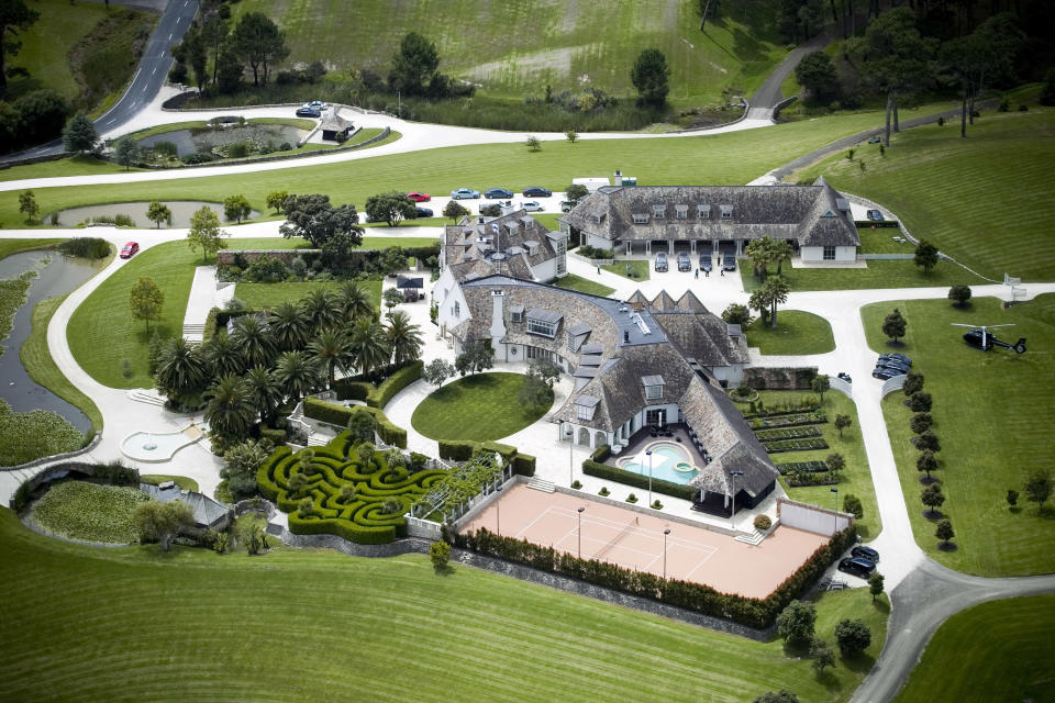 FILE - In this Jan. 20, 2012 file photo an aerial shot of Kim Dotcom's house is shown in Coatesville, north west of Auckland, New Zealand. On his way up, he fooled them all: journalists, judges, investors and companies. Then the man who renamed himself Kim Dotcom finally did it. With an eye for get-rich schemes and an ego gone wild, he parlayed his modest computing skills into a mega-empire, becoming the fabulously wealthy computer maverick he had long claimed to be. (AP Photo/NZ Herald, Natalie Slade, File) NEW ZEALAND OUT, AUSTRALIA OUT