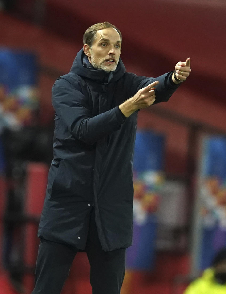 FILE - In this file photo dated Wednesday, Dec. 2, 2020, PSG's head coach Thomas Tuchel signals during a Group H Champions League soccer match against Manchester United at the Old Trafford stadium in Manchester, England. Thomas Tuchel is confirmed as the new Chelsea soccer team manager, Tuesday Jan. 26, 2021. (AP Photo/Dave Thompson, FILE)