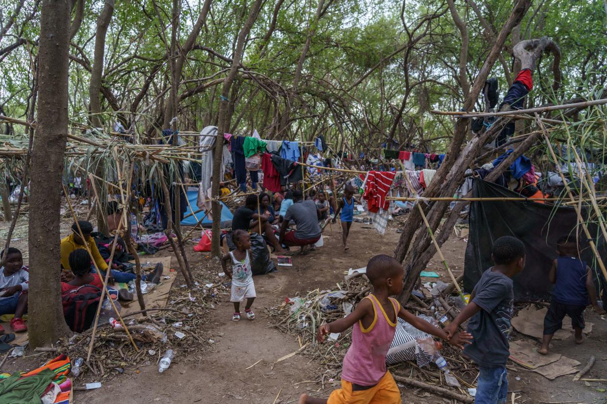 Haitian migrants are pictured in a makeshift encampment where more than 12,000 people hoping to enter the United States await under the international bridge in Del Rio, Texas on September 21, 2021. (Paul Ratje/AFP via Getty Images)