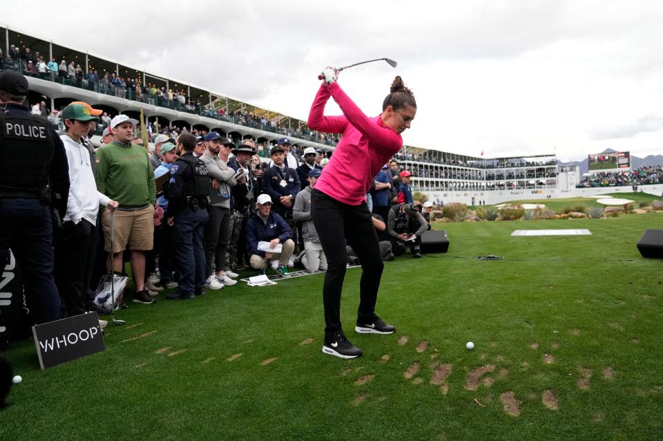 USWNT legend Carli Lloyd hits her shot during the WHOOP Shot at Glory on the 16th hole at TPC Scottsdale on Feb. 7, 2024.