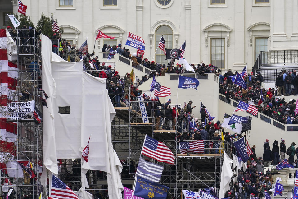 Trump supporters gather outside the Capitol, Wednesday, Jan. 6, 2021, in Washington. (AP Photo/John Minchillo)