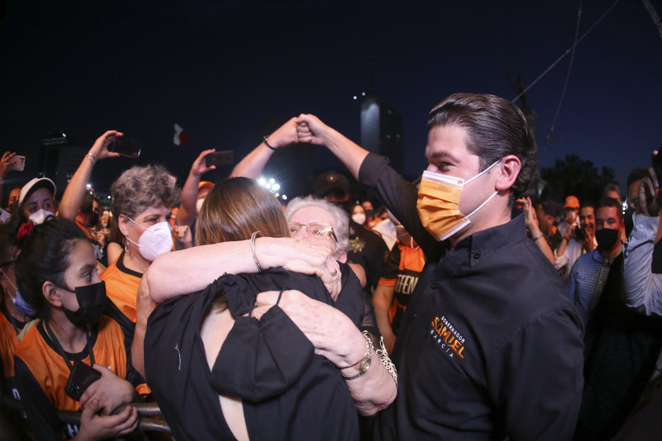 YouTuber Mariana Rodríguez and Samuel Garcia, the newly-elected governor of Nuevo Leon attend their victory celebration at the Macroplaza of Monterrey, in Nuevo Leon state, Mexico, Monday, June 7, 2021. Garcia, 33, is a baby-faced former senator whose blond wife, YouTuber Mariana Rodríguez, is better known for posting videos of herself giving makeup tutorials or clutching a small dog. (AP Photo/Roberto Martinez)