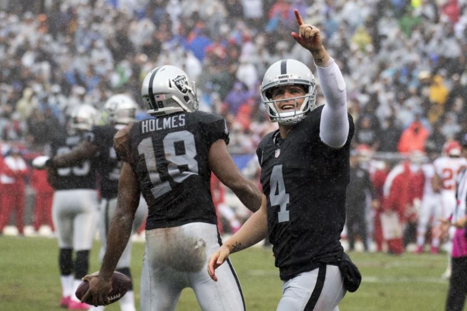 October 16, 2016; Oakland, CA, USA; Oakland Raiders quarterback Derek Carr (4) celebrates after a touchdown against the Kansas City Chiefs during the first quarter at Oakland Coliseum. Mandatory Credit: Kyle Terada-USA TODAY Sports