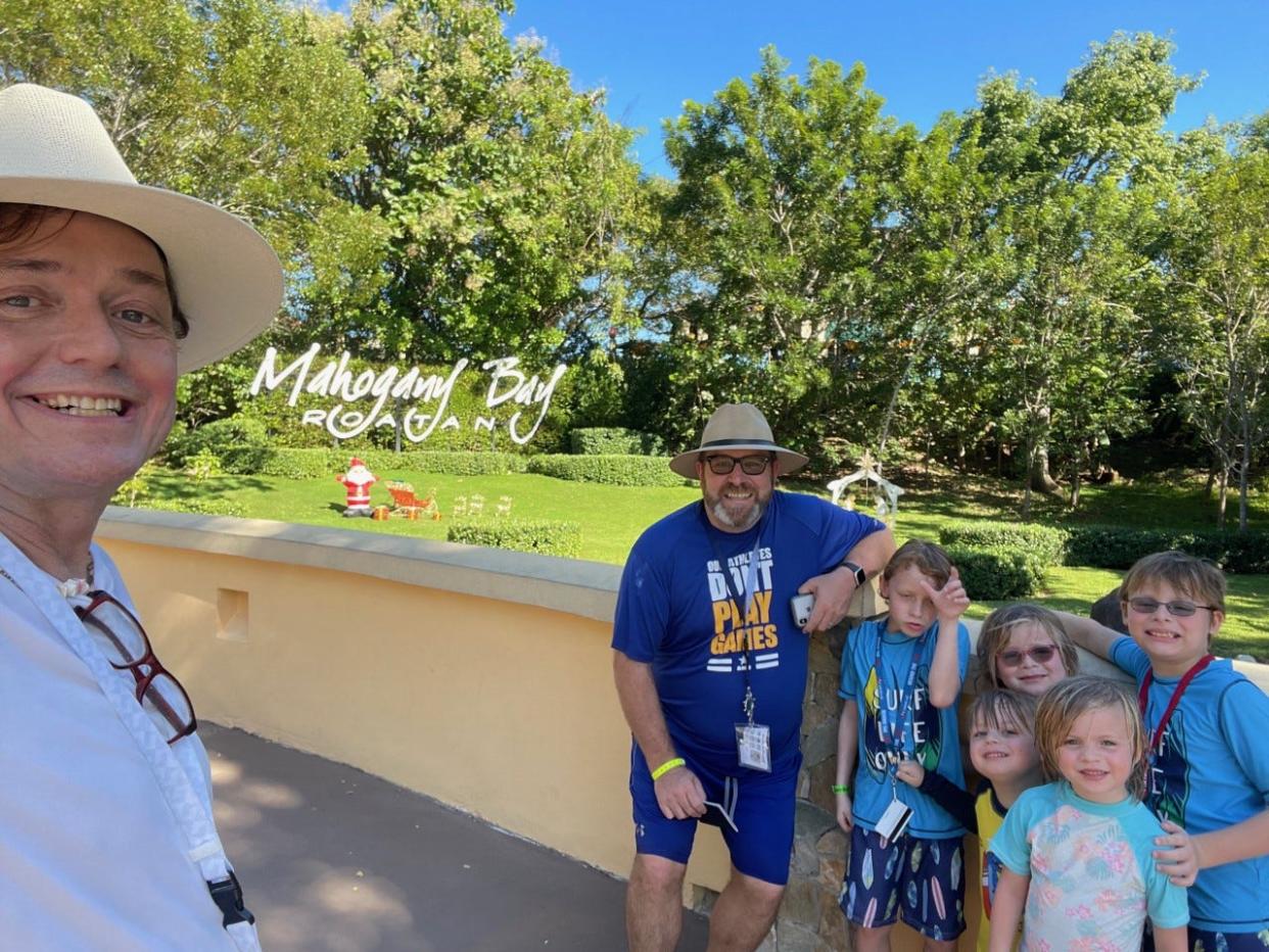 Brendan Peoples, right, and his husband, Edgar Castlow, cruise with their young kids once or twice a year.