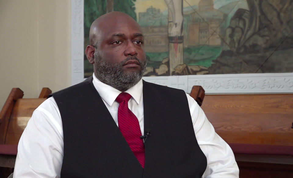 This photo from video shows Rev. Derrick Holmes during an interview with The Associated Press on Aug. 3, 2023 in Circleville, Ohio. In July, the K-9 program at the Circleville Police Department found itself under much greater scrutiny after police body and dash cameras recorded an officer's Belgian Malinois attacking a Black, kneeling trucker as he was surrendering alongside a highway with his hands up. "There's a certain class separation that happens here in Circleville as well, and it's not discussed" Holmes said. (AP Photo/Patrick Orsagos)