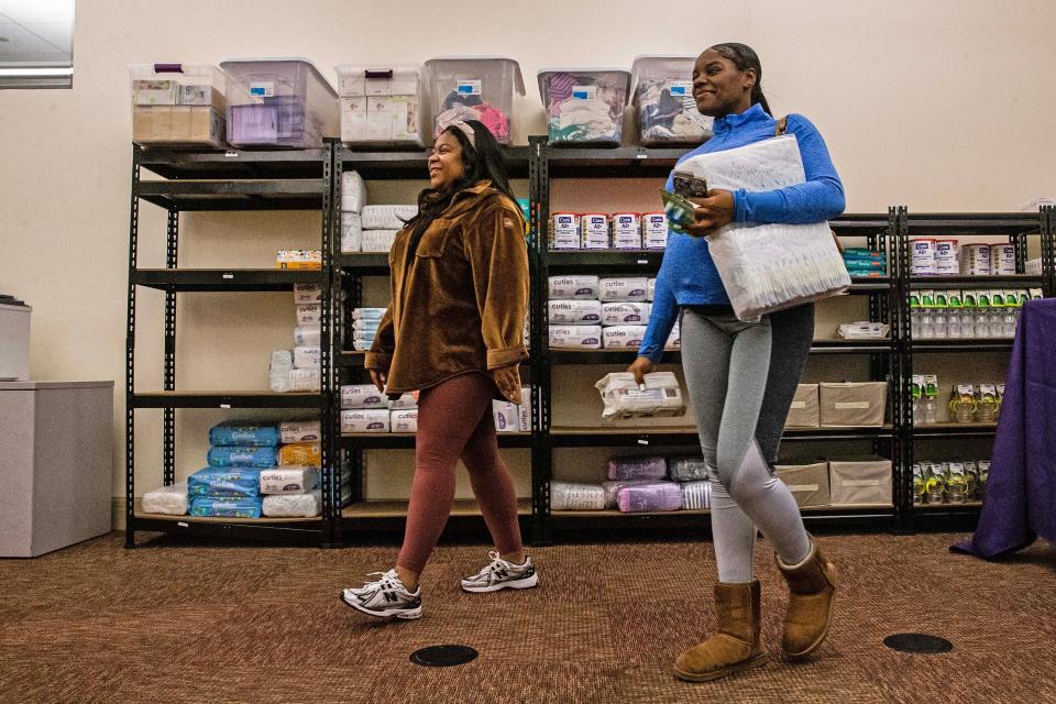 From left, founder Giovanna Andrews walks with participant Saleema Rivers during the Harper's Heart opening of The Closet of Love, a free diaper bank and community closet, at the Wilmington Public Library on Thursday, Jan. 11, 2024. Andrews first launched HarperÕs Heart, a non-profit, in 2018, which has experienced significant growth since.