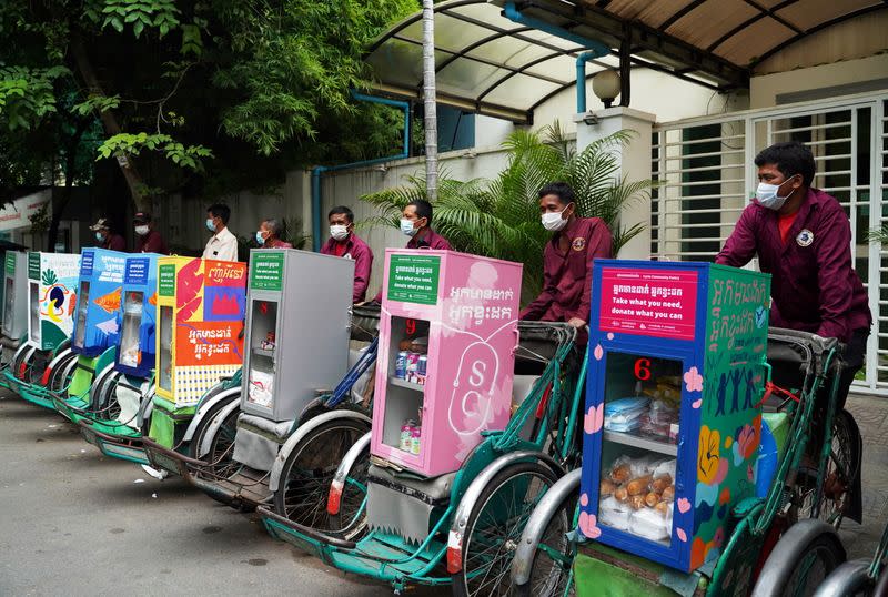 Cambodian cyclo-drivers pedal mobile food banks to deliver aid