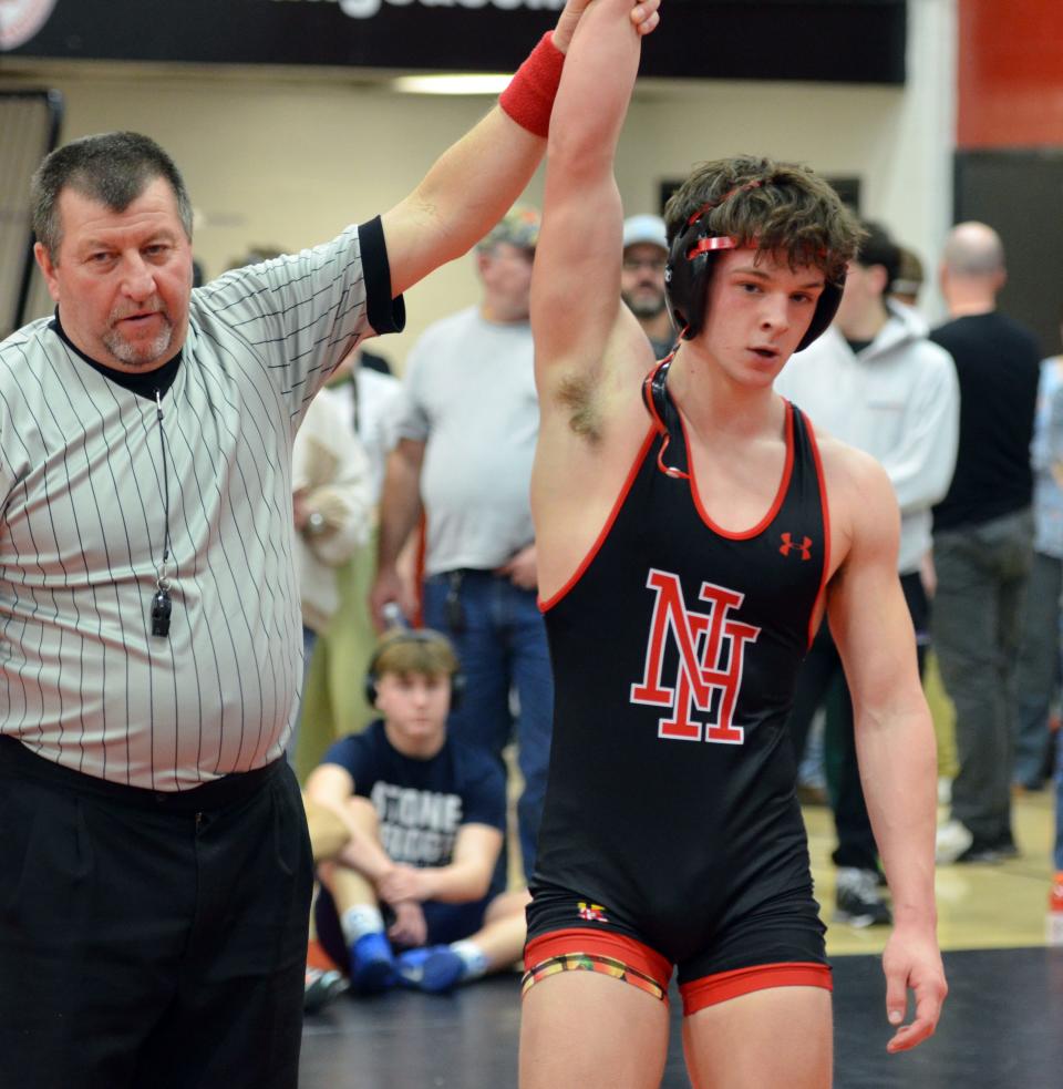 North Hagerstown's Luke Frazee has his arm raised in victory after pinning Berkeley Springs' Aidan Cain in the semifinals of the Hub Cup wrestling tournament at 150 pounds. Frazee finished in second place in the weight class.