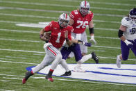 Ohio State quarterback Justin Fields (1) runs with the ball during the first half of the Big Ten championship NCAA college football game against Northwestern, Saturday, Dec. 19, 2020, in Indianapolis. (AP Photo/Darron Cummings)