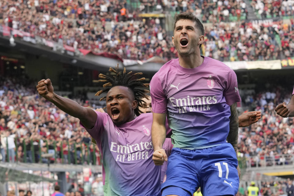 AC Milan's Christian Pulisic, right, celebrates with his teammates after scoring his side's opening goal during the Serie A soccer match between AC Milan and Lecce at the San Siro stadium, in Milan, Italy, Saturday, April 6, 2024. (AP Photo/Antonio Calanni)