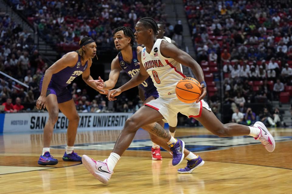 Arizona Wildcats guard Bennedict Mathurin (0) controls the ball against TCU Horned Frogs guard Micah Peavy (0) in the first half during the second round of the 2022 NCAA Tournament at Viejas Arena in San Diego on March 20, 2022.