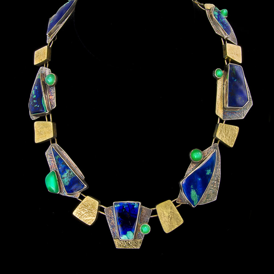 This undated publicity photo provided by Judy Hoch shows her handmade necklace, "Forest Colors," of sterling silver and 18K gold with copper minerals, azurite and malachite. Hoch, of Salida, Colo., worked in the computer business for more than 25 years before retiring and turning to jewelry-making. (AP Photo/Courtesy Judy Hoch, Jim DeLutes)