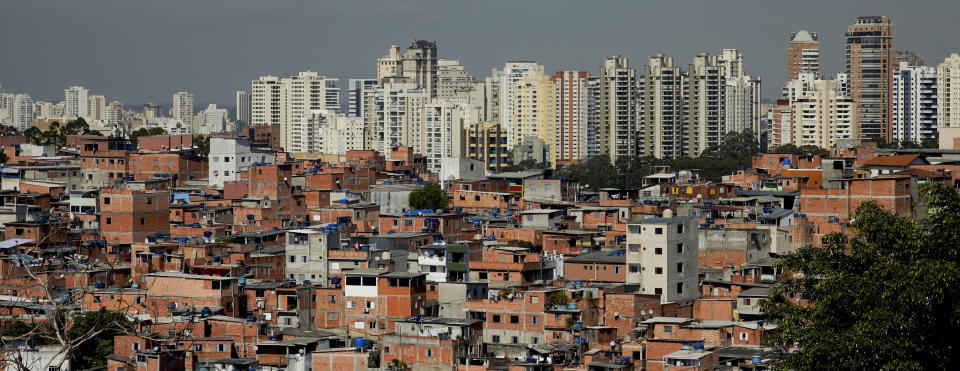 This May 22, 2019 photo shows brick and block brick houses of the sprawling slum neighborhood of Paraisopolis stacked next to the posh Morumbi neighborhood, in Sao Paulo, Brazil. A study released this month by the Getulio Vargas Foundation found that the key measure of income inequality has reached its highest level since the series began seven years ago, with Brazil among the most unequal nations in a broader region where the gap between rich and poor is notorious. (AP Photo/Victor R. Caivano)