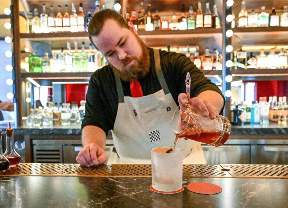 Bar director Ryan Metcalf prepares a Ricky Bobby drink, named for the movie “Talladega Nights: The Ballad of Ricky Bobby” at The Red Room, a new bar opening inside Pardini’s catering venue on West Shaw Avenue in Fresno.