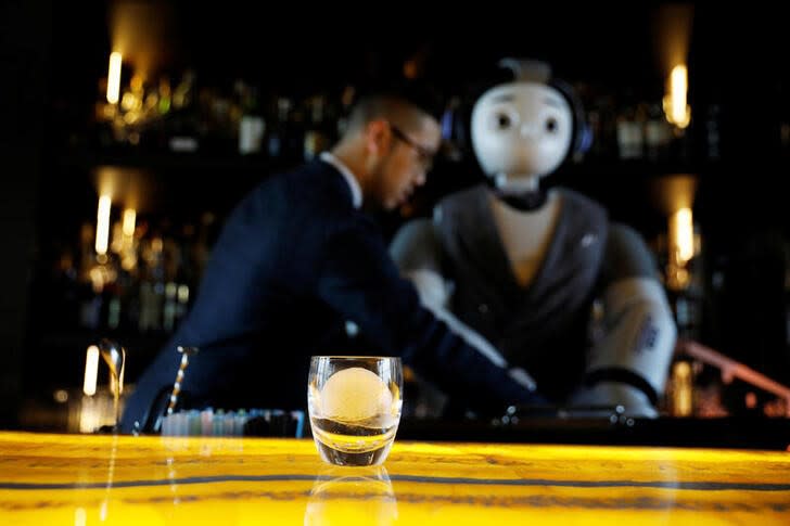 A carved ice block made by an ice carving robot as a measure to minimise human contact to avoid the spread of the coronavirus disease (COVID-19) rests in a glass during the robot's demonstration at a bar in Seoul