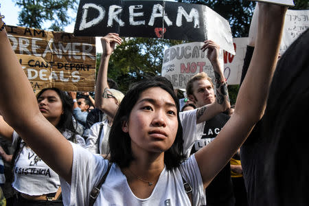 FILE PHOTO: People participate in a protest in defense of the Deferred Action for Childhood Arrivals program or DACA in New York, NY, U.S., September 9, 2017. REUTERS/Stephanie Keith/File Photo